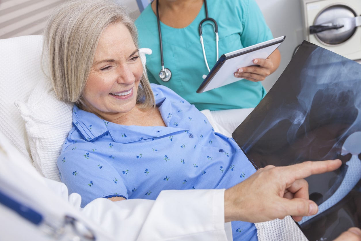 Doctor reviewing xray with patient